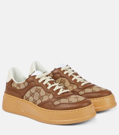 fashion luxury Gucci GG Canvas leather-trimmed sneakers in brown